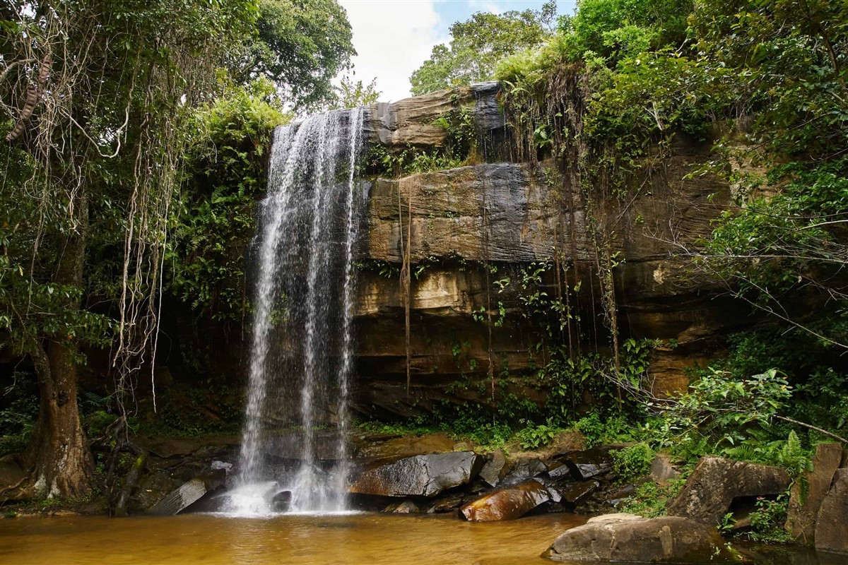Sheldrick Falls cascading through the tropical forest