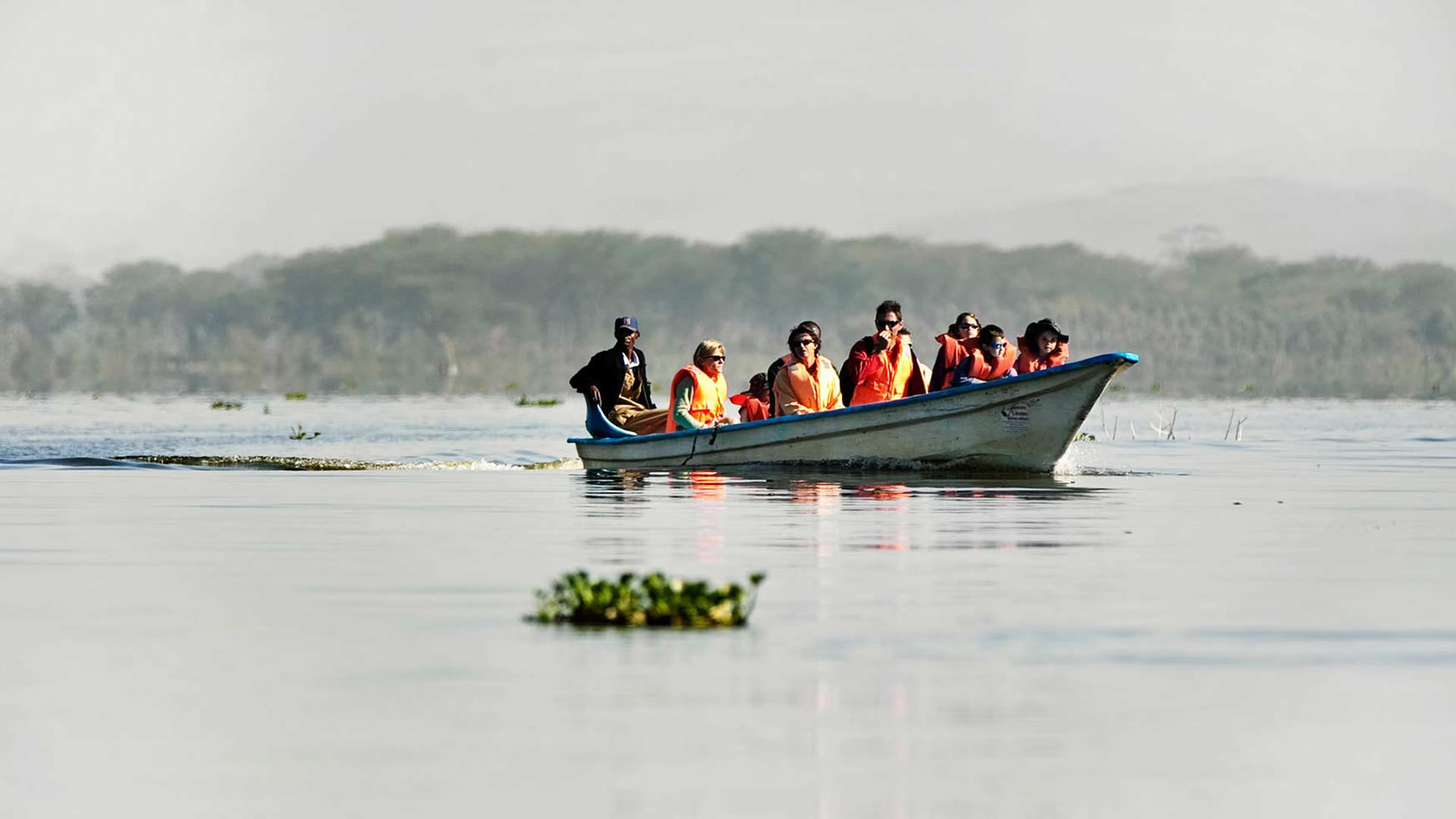Guests crossing Lake Naivasha on a boat safari