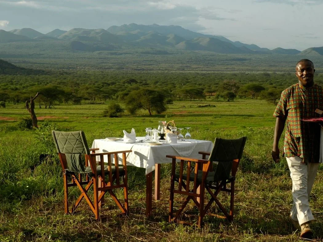 Private bush dinner set up with views of the Chyulu Hills near Kilaguni Serena Safari Lodge