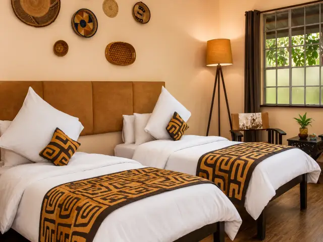 Twin room at Acacia Tree Lodge with African textiles